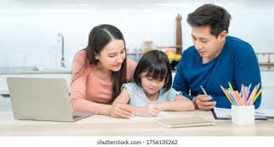 Parent helping a child study